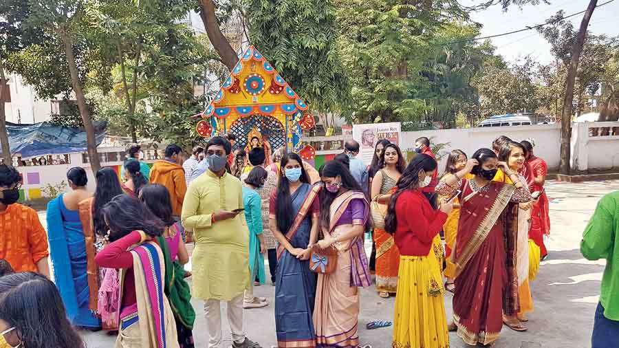 Students of Bidhannagar Municipal School gather before the idol on campus on Saraswati Puja. 