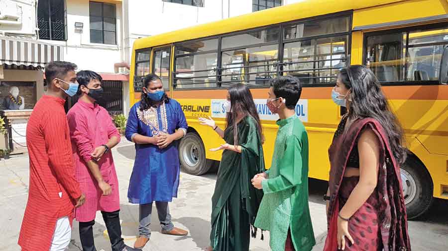 Students catch up after the puja at St Francis Xavier School