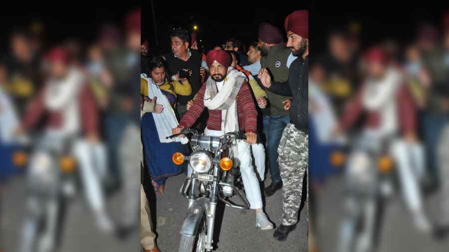 Punjab chief minister Charanjit Singh Channi rides a motorcycle during a road show in Jalandhar recently