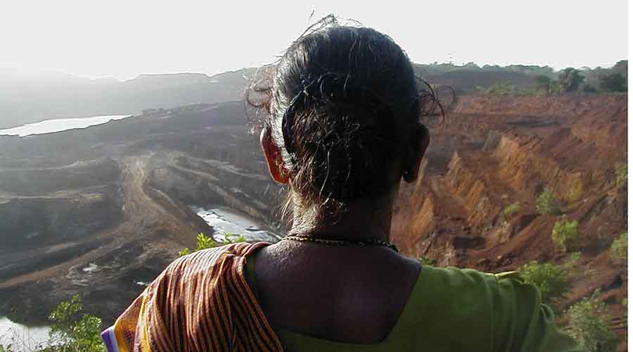 A villager looks at mining devastated areas in Goa. 