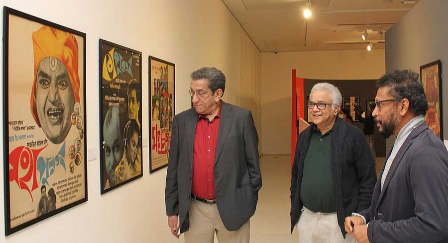 Director Shoojit Sircar (from right), actor Siddhartha Chatterjee and actor Sabyasachi Chakraborty look at posters of auteur Satyajit Ray’s films at The Satyajit Ray Centenary Show at Kolkata Centre for Creativity on Sunday 