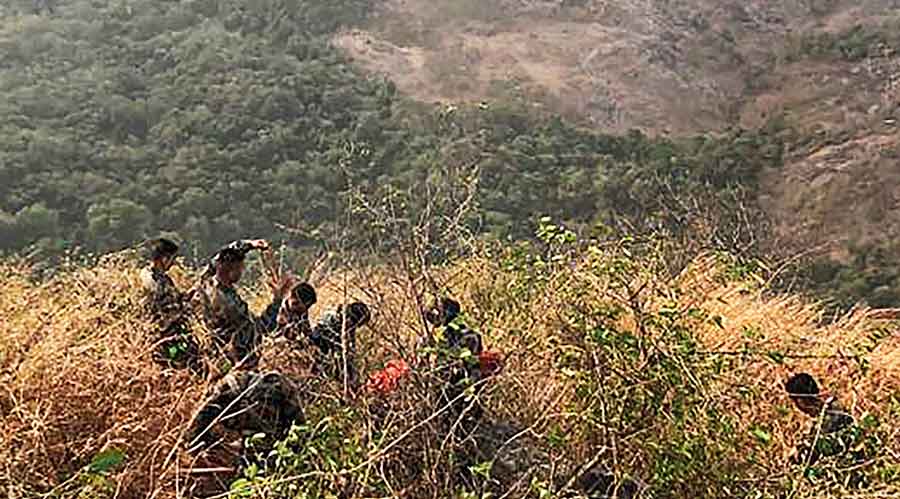 Army personnel perform rescue work to save Babu, a trekker trapped in a steep gorge in Malampuzha mountains in Palakkad, Kerala. Babu has been rescued.