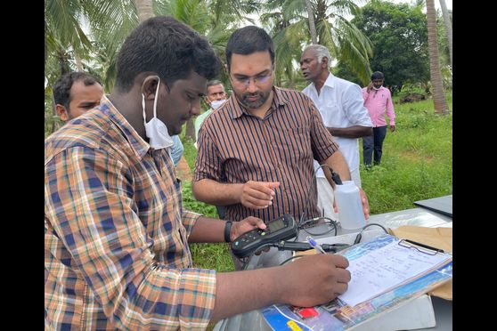 Venkatraman Srinivasan, assistant professor IIT-Madras and Rajagopal S, PhD student, measuring water quality parameters of a well in Ayankulam village, Tirunelveli