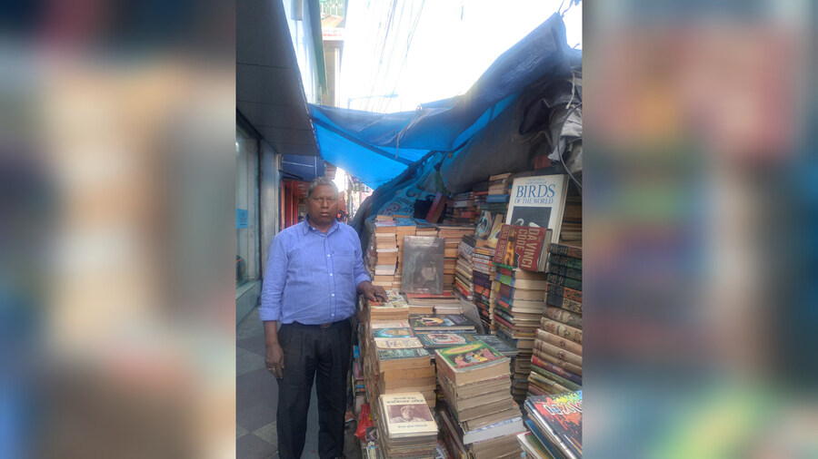 Nirmal Mondal has been running his book stall since the time there were only a handful of them on this stretch