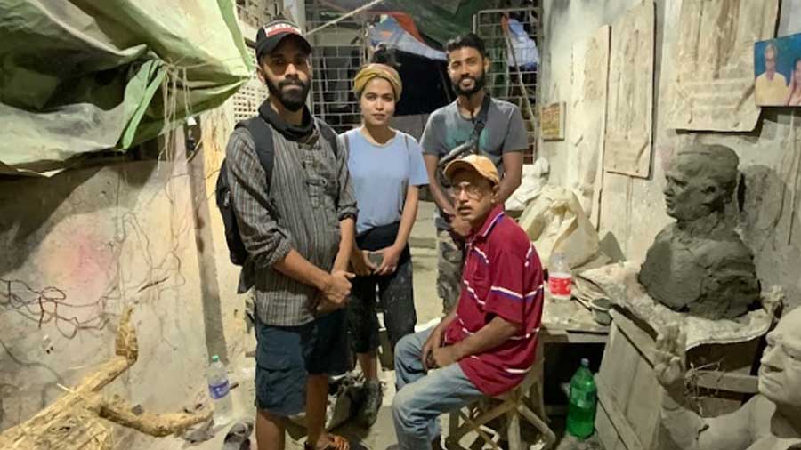 (L-R) Afzan Pirzade, Rohma and Rahul with one of the Kumartuli artisans who became an inspiration for the mural