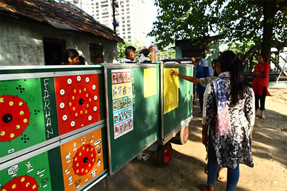 The cart comes equipped with a variety of learning materials and extendable blackboards. 