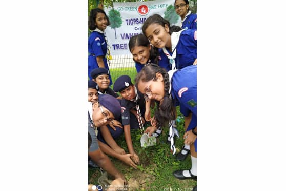 Prasham planting saplings with fellow Scouts and Guides at Van Mahotsav.
