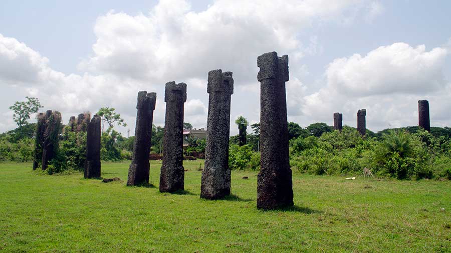A series of monolithic stone pillars in different arrangements can be seen on the site 
