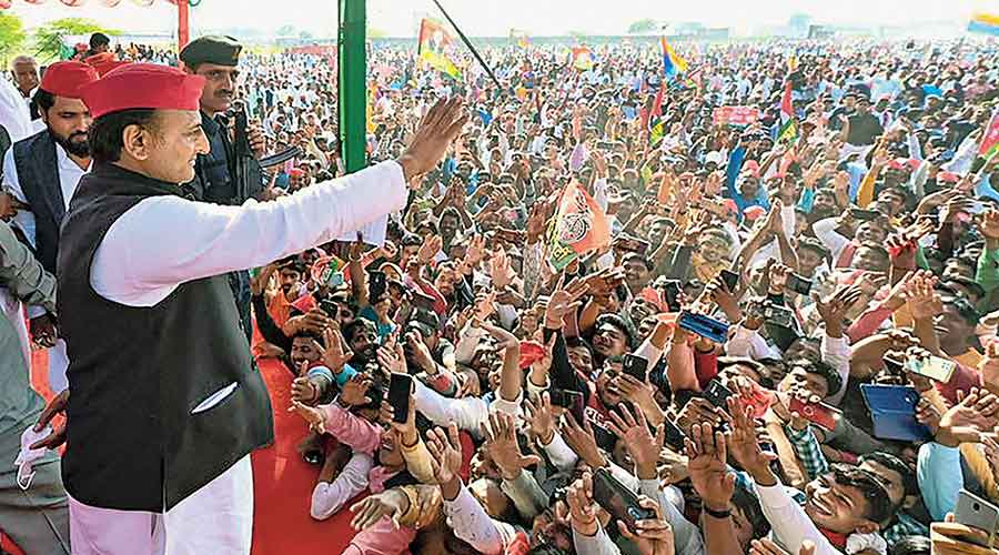 Akhilesh Yadav waves at the people at an election rally in Kaushambi on Tuesday.