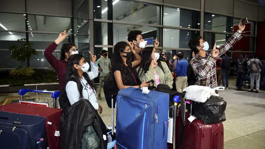  Indian nationals take selfie upon their arrival at the IGI Airport by an Air India flight from Ukraine amid rising Russia-Ukraine tension, in New Delhi.