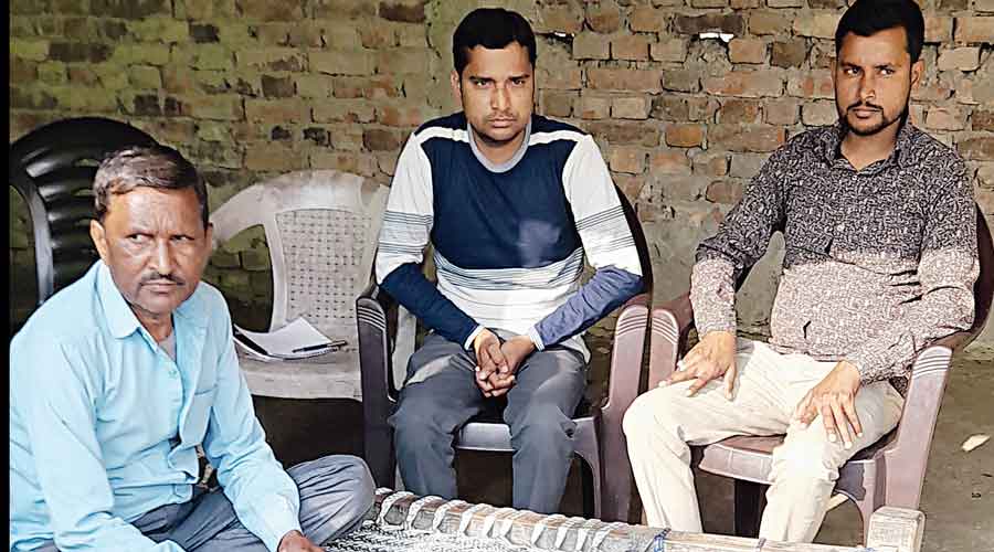 Ramdulari Kashyap, father of Raman Kashyap who was killed in the Lakhimpur Kheri violence  last year, with sons Pawan and Rajat .
