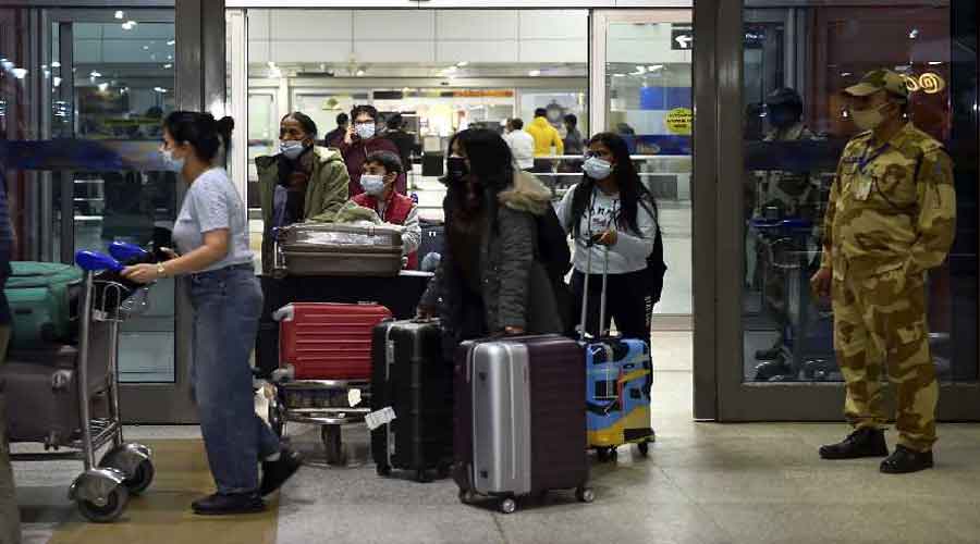 Indian nationals come out from the IGI Airport on their arrival from Ukraine amid rising Russia-Ukraine tension, in New Delhi