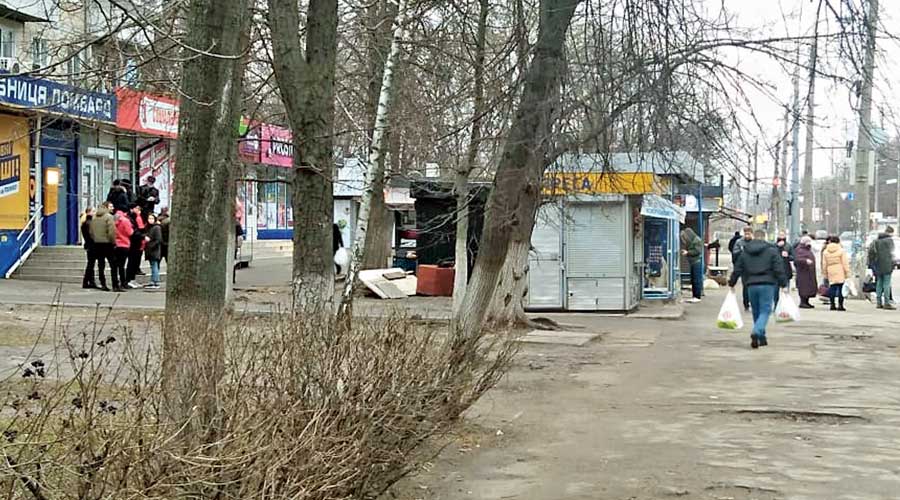 A queue outside another ATM and residents with grocery bags in Kiev