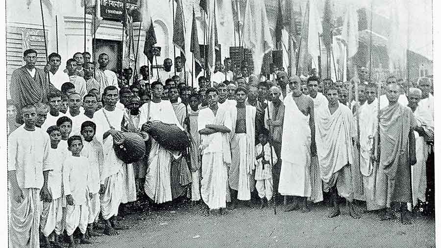 Bhaktisiddhanta Saraswati with a sankirtan party outside the building, then known as Bhaktivinoda Asan