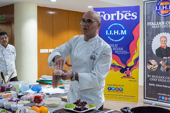 Chef Enzo Oliveri demonstrates the right way to cut the fish for Fish Carpaccio, a Mediterranean coastal dish during a masterclass hosted by the International Institute of Hotel Management (IIHM).