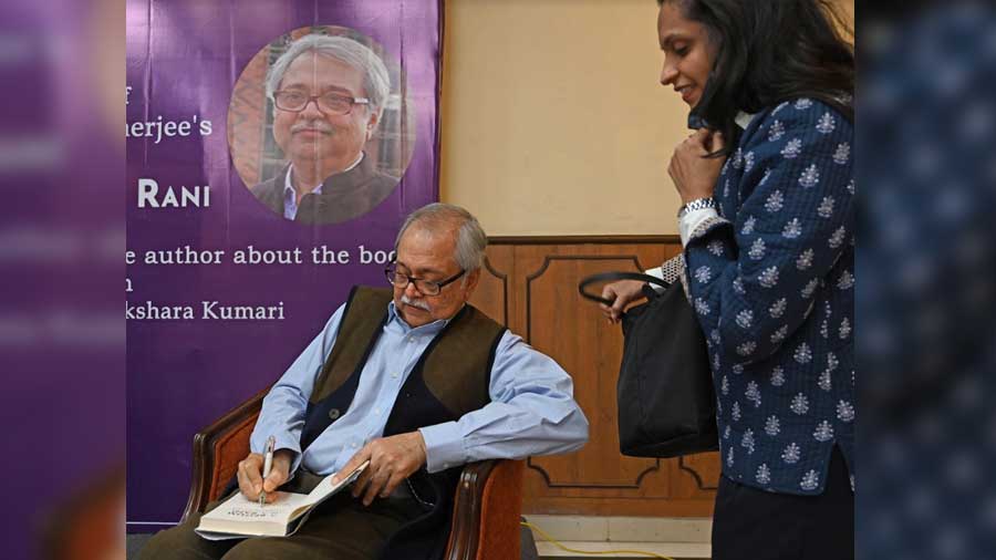 Rudrangshu Mukherjee signs a copy of his book after the programme, at The Bengal Club 
