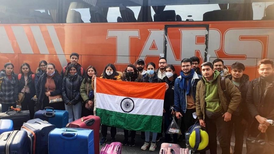 Indian nationals before boarding the flight back home