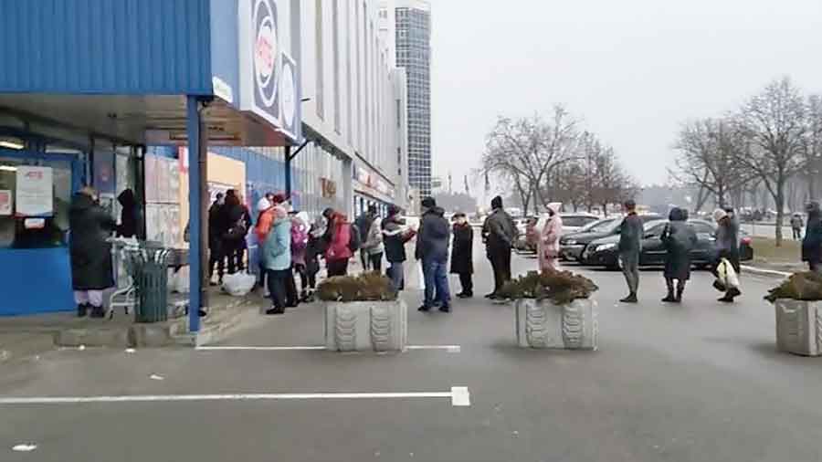 The queue outside a supermarket in Kyiv on Saturday.