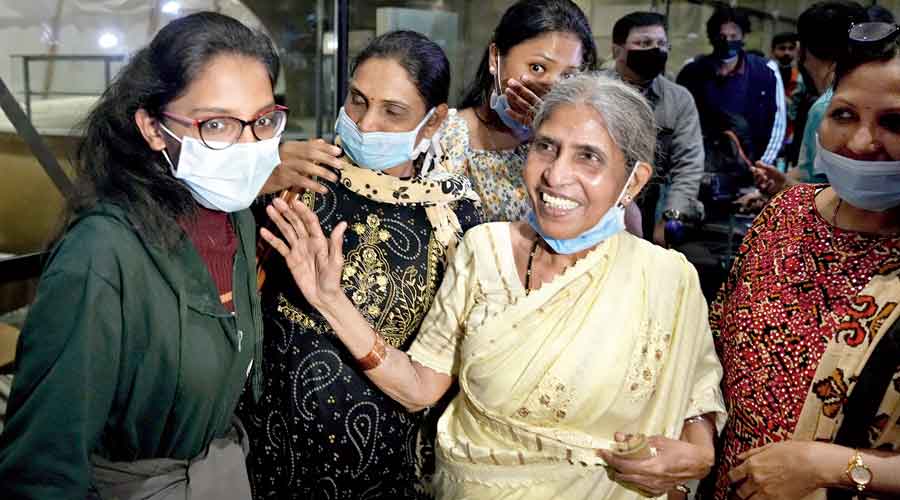 Indian nationals, evacuated from Ukraine, react on their arrival at Mumbai airport on Saturday.