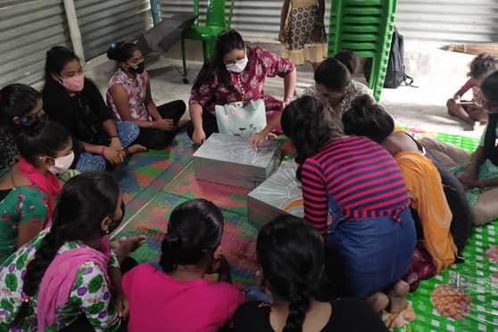 Snapshot of students teaching children at CRY. 