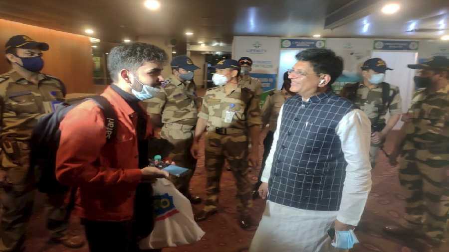 Union Minister Piyush Goyal wekcomes Indian nationals evacuated from crisis-hit Ukraine, on their arrival at the airport in Mumbai on Saturday.