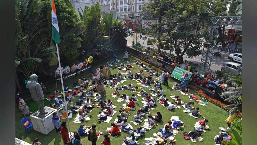  Students sit and draw on the lawns of Apeejay House on Park Street on Saturday 