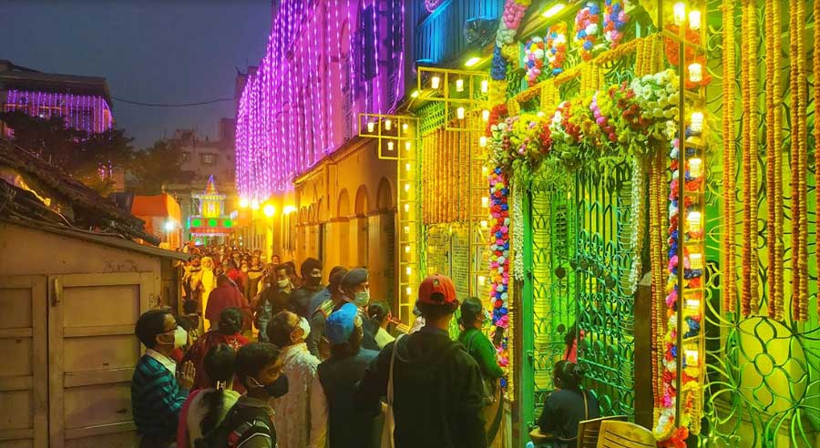 SILENT PRAYERS: Devotees pay respect to Holy Mother Sri Sarada Devi, the wife of Sri Sri Ramakrishna Paramhansa, at the brightly illuminated ‘Ma-er Bari’ in Bagbazar in north Kolkata on her 169th birth anniversary on Sunday, December 26.  The celebrations held on the occasion at the Ramakrishna Math and Ramakrishna Mission world headquarters at Belur Math were live-streamed on Youtube and Facebook. 