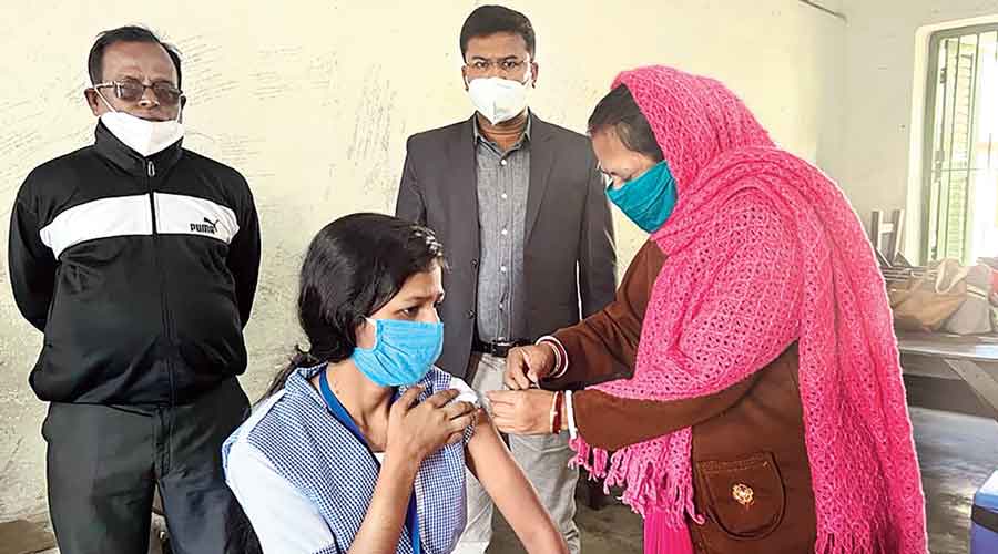 A student gets a jab at Netra High School in Diamond Harbour, South 24-Parganas, on Monday. 