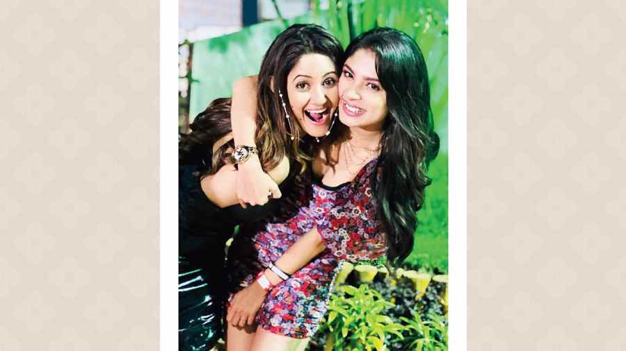 #SPOTTED: Tolly TV dames Trina Saha Bhattacharya with friend Adrija Roy. “Bijlee bijlee is my favourite song of the year, and the end to the year could not have been a better one than this,” smiled Trina who was turning heads in a one-shoulder latex black mini dress, while Adrija opted for a floral number.