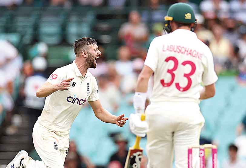 England’s Mark Wood (left) celebrates after dismissing Marnus Labuschagne of Australia on Day I of the fourth Ashes Test at the SCG.