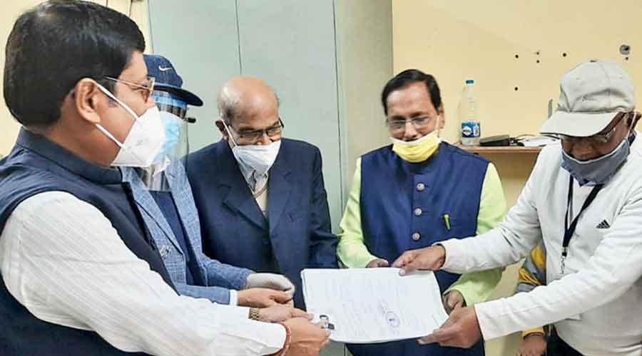Trinamul Congress candidate Sabyasachi Dutta submits his nomination papers on Monday.