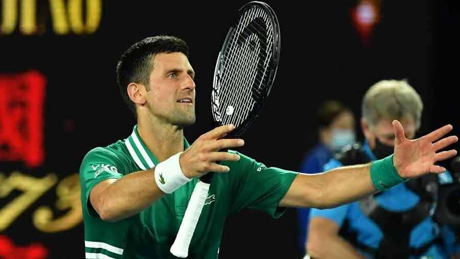 Novak Djokovic wins the first ever airport lobby tennis match, edging out five Melbourne airport officials 7-6, 7-6 in a handicap contest 