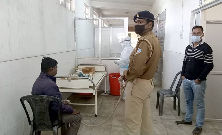 One of the accused waiting for a Covid test