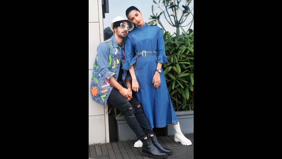 Sana posed for a lean look in this Mandarin-collared ankle-length outfit and Priyanshu complements the frame with a Diseno oversized.