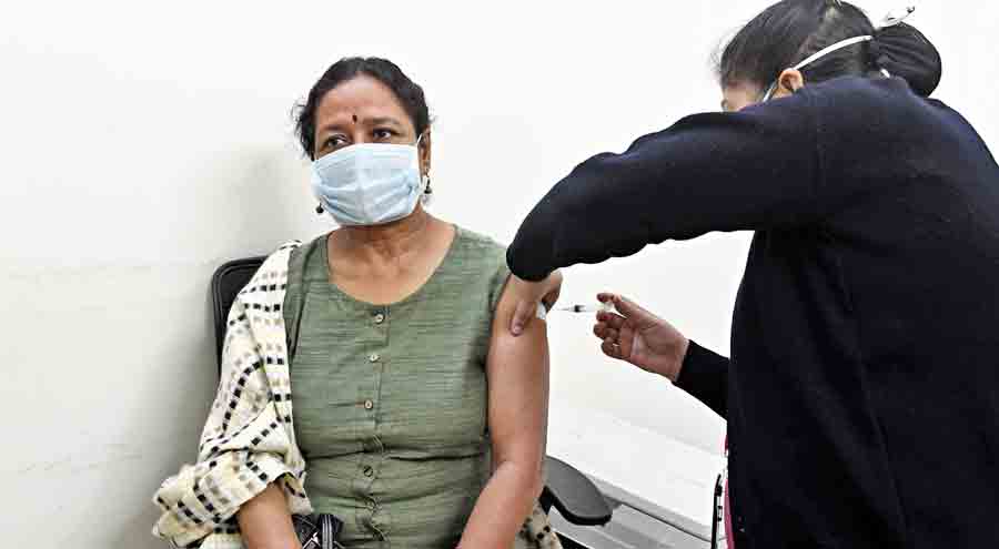 Debjani Sarkar, 61, gets her booster vaccine dose at a private hospital in Dhakuria on Monday.