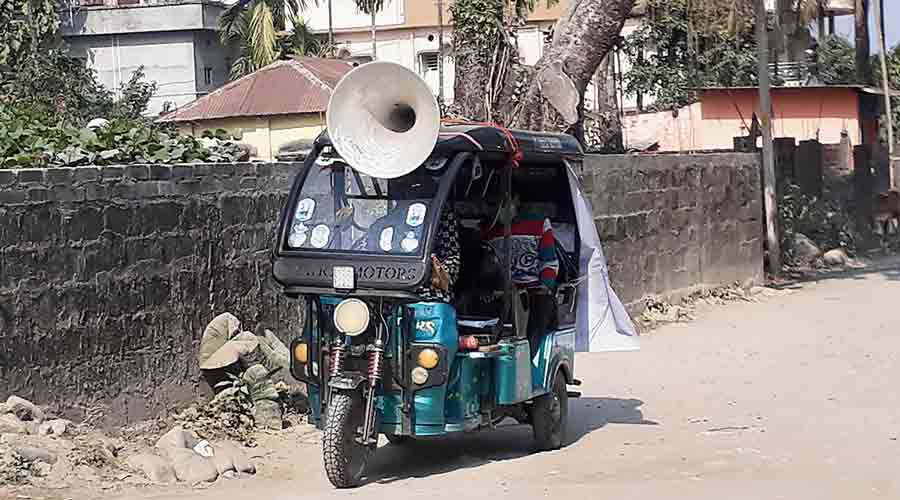 An e-rickshaw engaged by the administration to make public announcements with regard to Covid-19 restrictions in Siliguri on Monday.