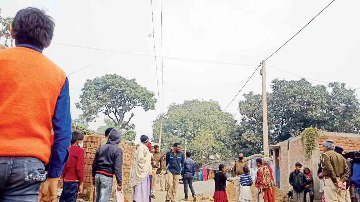 Police and villagers at the place where the minor was tied and assaulted in Sahibganj