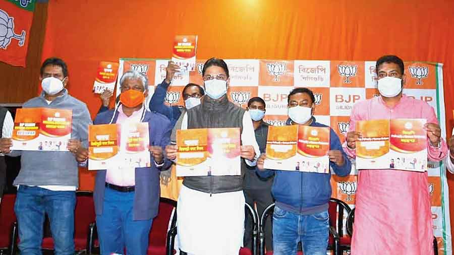 BJP leaders release the manifesto for the SMC polls on Tuesday. 