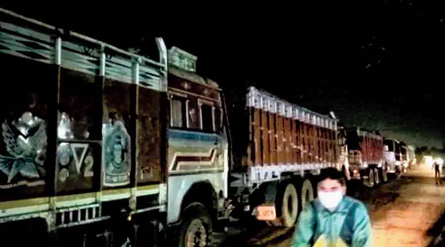 Sand-laden trucks stand still during the blockade at Sarpi village near Durgapur on Wednesday evening. 
