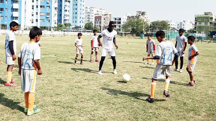 Omar Samba trains youngsters at the camp in BA Block, New Town on Sunday. 