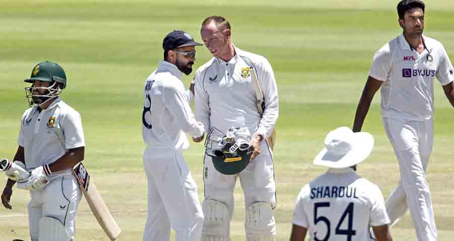 Virat Kohli congratulates Rassie van der Dussen after South Africa’s victory  in the final Test by 7 wickets, in Cape Town on Friday.
