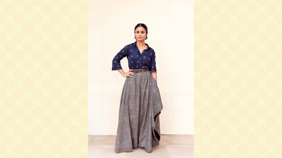 Mix and match: Rasika’s style has often been about clubbing Indo-western in the coolest way possible. This blue bandhej shirt with a chequered grey asymmetrical skirt by Aapro is a fine example of fusion, which the actress pulled off with elan. 