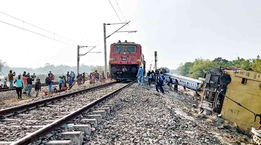 An electric loco on Saturday passes through the track on which the derailment occurred. 