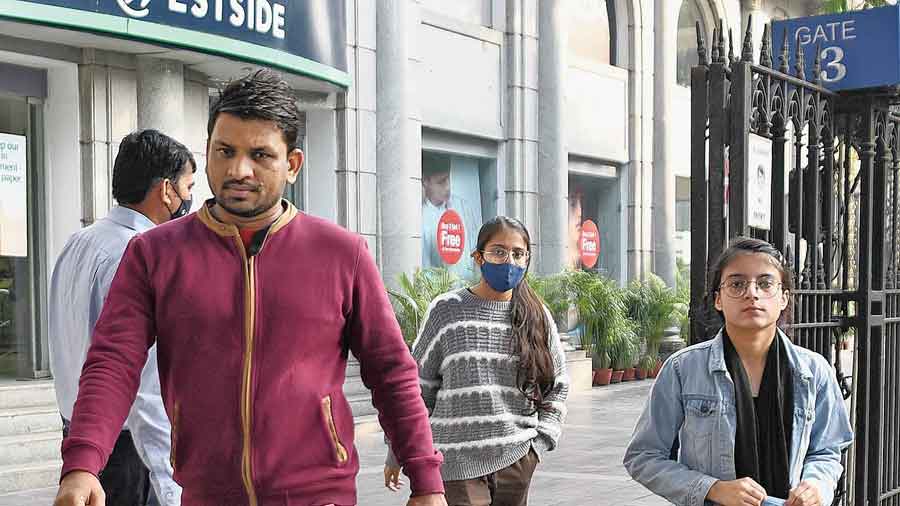 Outside a mall on Camac Street, a man and a woman were without masks. Both were holding masks in their hands. “I have the mask. I always wear it,” said the man.