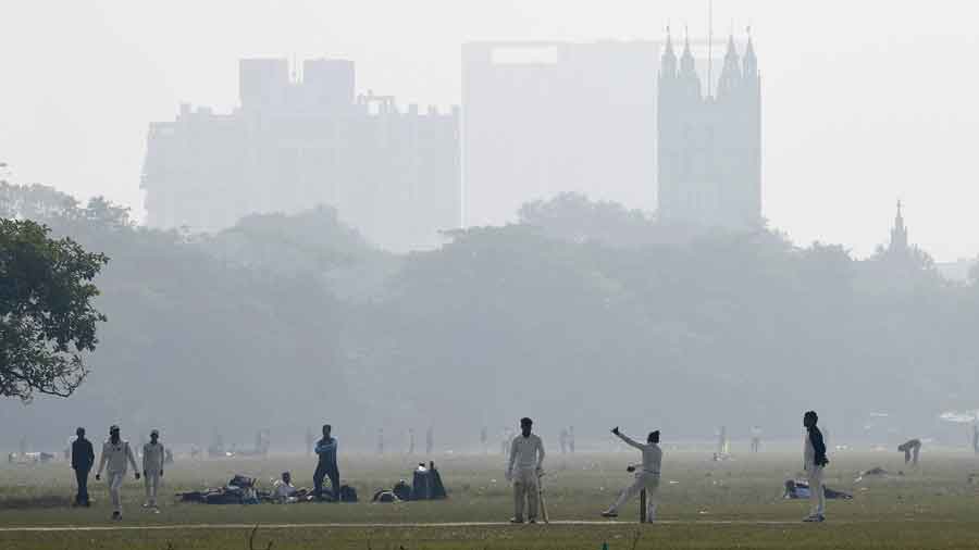 Cricketers on a foggy Maidan on Wednesday morning.