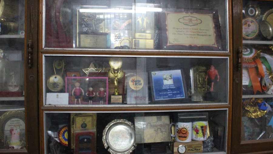 Shelves of Debnath’s study filled with his awards and trophies