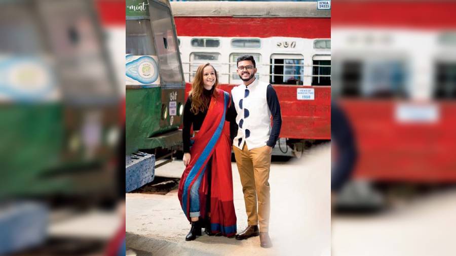 Pauline Laravoire posed in a red denim-border gicha silk sari made with upcycled denim and Meghdut RoyChowdhury wore the denim hemicycle waistcoat made of cotton and industry-waste denim for a dapper look.