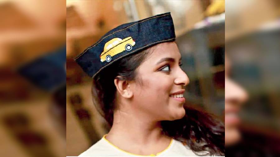 This scrap denim Nehru topi with the Calcutta yellow cab embroidery is a statement look with a quirky touch.