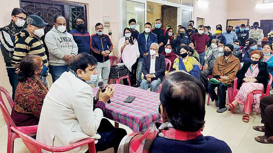 Minister and local MLA Sujit Bose addresses an indoor meeting with residents in support of his party’s Ward 41 candidate Ratna Bhaumik at AA Block community centre on Sunday.