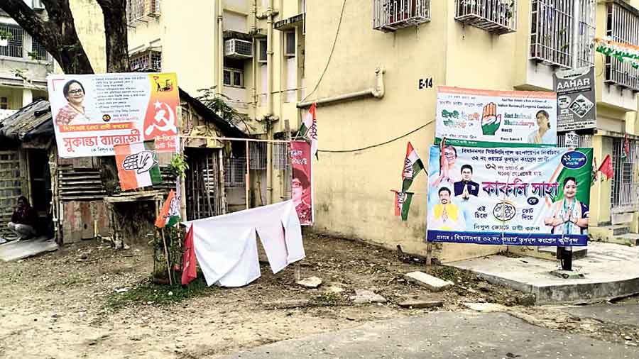 Suhita Basumallik’s ripped banners hang next to publicity material of candidates of other parties in Ward 32. 